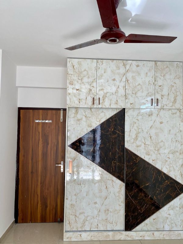 Brown and White Marble Finish sliding Wardrobe Designs with Loft