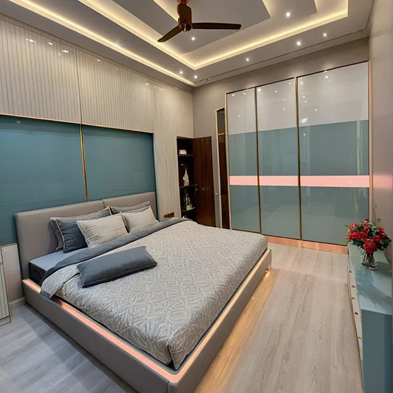 Modern bedroom setup designed by bedroom furniture shop in Kasheli with elegant bed and wardrobe