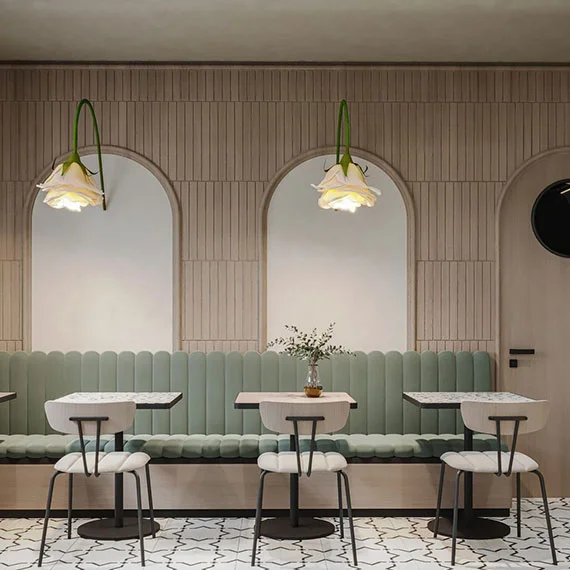 Modern café-style dining area designed by restaurant interior service in Kasheli